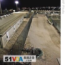In this photo, reviewed by US military, the exercise yard at Guantanamo's Camp 4 detention facility is pictured before dawn, 14 May 2009