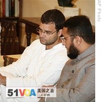 Congress Party leader Rahul Gandhi, left, listens to Majlis-e-Ittehadul Muslimeen leader Asad Owaisi at meeting of Congress-led alliance parties, in New Delhi, 20 May 2009