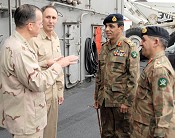 Admiral Mike Mullen, left, Rear Admiral Scott Van Buskirk talk with Pakistani Army General Ashfaq Kayani and Pakistani Army Lt. General Ahmad Shuja Pasha (US Navy Photo)