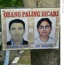 A poster bearing image of Southeast Asia terror ringleaders Noordin M. Top (l) and Azhari bin Husin is put on a tree in Jakarta (File)