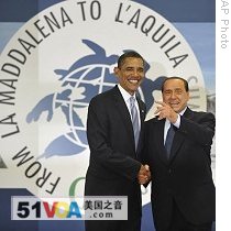 US President Barack Obama, left, is greeted by Italian Prime Minister Silvio Berlusconi at the G8 summit in L'Aquila, Italy, 08 Jul 2009