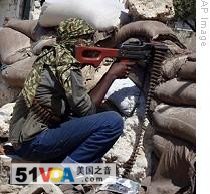 An al-Shabaab fighter in north Mogadishu following fighting the previous day which marked the first direct intervention of AU peacekeepers in support of Somali government forces, 13 Jul 2009