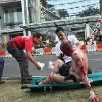 A man is being treated at the scene of the bombings