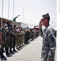 ISAF commander in Afghanistan, Gen. Stanley McChrystal (R), salutes ISAF soldiers during changing of command ceremony in Kabul on 10 Jul 2009