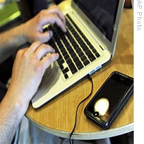 A man works on his laptop at a coffee shop in Columbia, Mo., (file photo)