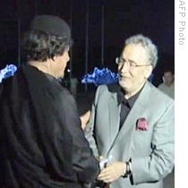 In this image grab taken from a newscast on Libya's official television, Libyan leader Moammar Gadhafi (L) welcomes freed Lockerbie bomber Abdelbaset al-Megrahi (R) in Tripoli, 21 Aug 2009