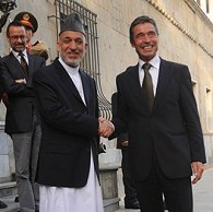 Afghan President Hamid Karzai shakes hands with new NATO Secretary-General Anders Fogh Rasmussen (right) at the presidential palace in Kabul, 05 Aug 2009