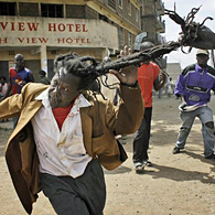 A Kikuyu man is attacked by rioters in the Mathare slum, Nairobi, Kenya, 20 Feb 2008