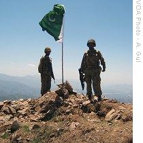 Pakistani soldiers under their flag in Swat valley, 22 May 2009