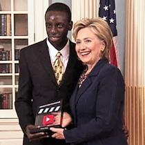 Chansa Tembo accepts an award from Secretary of State Hillary Clinton