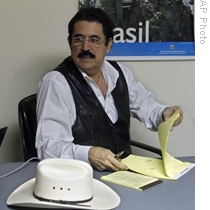 Ousted Honduran President Manuel Zelaya attends a meeting with his representatives at the Brazilian embassy in Tegucigalpa, 16 Oct 2009