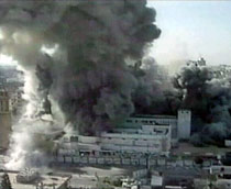 Smoke rising from a building bombed during Israel's recent military assault on the Gaza strip (VOA TV)