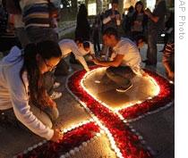Students from the American University of Beirut light candles to bring attention to AIDS in Lebanon on World AIDS Day