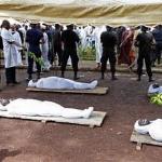 In this 02 Oct 2009 file photo, people view the bodies of family members and friends put on display days after security forces opened fire on pro-democracy protesters at a Sept. 28 rally in Conakry, G