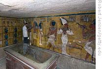 Experts examining the wall paintings in King Tut's tomb