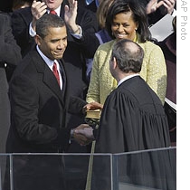 President Obama with his wife, Michelle, and Chief Justice John Roberts after taking the oath of office
