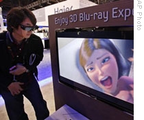 An attendee looks at a 3D movie at CES in Las Vegas, Nevada