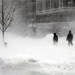 Two men walk backwards into blowing snow as another winter blizzard hits the nation's capital with whiteout conditions, 10 Feb 2010 in Washington