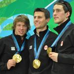Mathieu Giroux, Lucas Makowsky, and Denny Morrison of Canada show off their gold medals in team pursuit speedskating in Vancouver, Canada, 27 Feb 2010