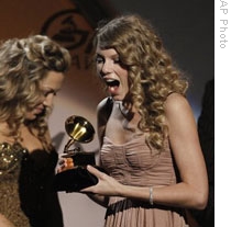 Taylor Swift accepting one of her Grammy Awards