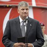 In this Sunday, May 24, 2009 file photo, Franklin Graham prepares to give the invocation before the NASCAR Coca-Cola 600 auto race at Lowe's Motor Speedway in Concord, N.C. A watchdog group objected Tuesday, April 20, 2010 to Graham's invitation to speak 