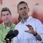 President Barack Obama, accompanied by Alabama Gov. Bob Riley, left, makes remarks at the Theodore Staging Area in Theodore, Alabama, 14 June 2010