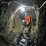 A Palestinian tunnel-digger works inside a smuggling tunnel where four Palestinian workers were killed in Rafah, southern Gaza Strip, 29 Apr 2010