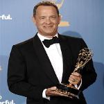 Producer Tom Hanks poses in press room with award for outstanding miniseries for 