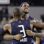 LeBron James hugs Dwyane Wade of the Miami Heat 