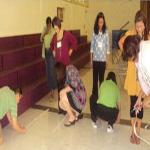 Teachers measure the distance of five steps during a Singapore Math training session. 