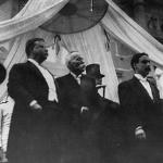 Theodore Roosevelt, left, stands with Manuel Amador, center