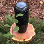 Ashes are buried at the base of trees in biodegradable urns made of corn starch.
