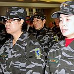 Members of the North Korea Peoples Liberation Front at a briefing in Seoul