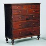 A wooden chest of drawers