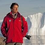 James Balog, pictured here in Greenland, has designed, programmed and installed time-lapse cameras on glaciers to record the impact of a warming climate. 