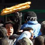 Tunisians waited outside a bakery in Tunis on Sunday as bread and milk were in short supply. An uprising last week ousted longtime president Zine El Abidine Ben Ali.