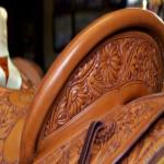 Many of Nancy Martiny's saddles are simple with the rough part of the leather exposed. Others, such as the one in this picture, sport intricate flower designs. 