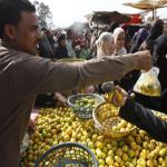 Egyptians shop at a vegetable market in Cairo on February 6, 2011. 