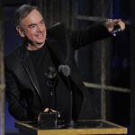 Inductee Neil Diamond accepts his trophy at the Rock and Roll Hall of Fame induction ceremony