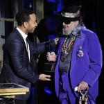 Dr. John, right, is presented his trophy by John Legend at the Rock and Roll Hall of Fame induction ceremony
