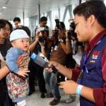 A baby arriving from Japan receives nuclear radiation detection from at Kuala Lumpur International Airport in Sepang, Malaysia.