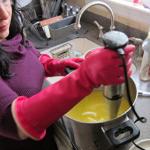 Mary Kearns mixing together the ingredients for lavender soap