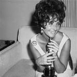 Elizabeth Taylor holds the Academy Award she won for her role in 