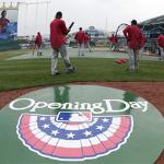 Los Angeles Angels players warm up before an opening day baseball game against the Kansas City Royals in Kansas City, Missouri