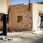 Heavy gunfire pockmarks houses in the Bira neighbourhood in Misrata, a rebel bastion 120 kms (75 miles) east of Tripoli, on April 15, 2011