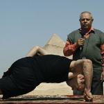 An Egyptian man attempts a Guinness World Record for doing push ups on the two fingers of his right hand only last year