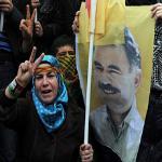 A person holds a poster of jailed Kurdish rebel leader Abdullah Ocalan as Kurdish demonstrators march in Istanbul, Turkey, April 19, 2011