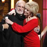 Larry Kramer, left, is hugged by Daryl Roth after they won the Tony Award for Best Revival of a Play for "The Normal Heart" during the 65th annual Tony Awards,  June 12, 2011 in New York. 