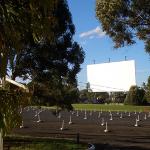 This drive-in theater is in Australia, but the photo gives you a good idea of how the speakers are lined up and waiting for cars and their occupants to arrive for the show.  